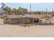 Tan house with covered patio and mountain views at 6210 N Poplar St, Maricopa, AZ 85139