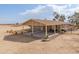 Tan house with covered patio and mountain views at 6210 N Poplar St, Maricopa, AZ 85139