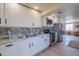 Modern kitchen with white cabinets and stainless steel appliances at 6210 N Poplar St, Maricopa, AZ 85139