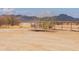 Empty lot with desert landscape and mountain views at 6210 N Poplar St, Maricopa, AZ 85139