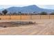 Empty lot with desert landscape and mountain views at 6210 N Poplar St, Maricopa, AZ 85139