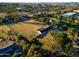 Aerial view showing a home with a large yard and distant city view at 6212 S 37Th St, Phoenix, AZ 85042