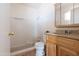 Simple bathroom with a shower/tub combo and wooden vanity at 6212 S 37Th St, Phoenix, AZ 85042