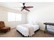 Bright bedroom with a comfortable bed and a ceiling fan at 6212 S 37Th St, Phoenix, AZ 85042