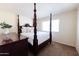 Bright bedroom featuring a four poster bed and ample closet space at 6212 S 37Th St, Phoenix, AZ 85042