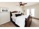 Serene bedroom with a wooden bed frame and access to a patio at 6212 S 37Th St, Phoenix, AZ 85042