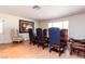 Elegant dining room featuring a large table, leather chairs, and a statement art piece at 6212 S 37Th St, Phoenix, AZ 85042