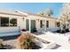 Front view of a charming home with landscaping and teal door at 6212 S 37Th St, Phoenix, AZ 85042