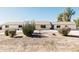 Landscaped front yard with a white brick home and cacti at 6212 S 37Th St, Phoenix, AZ 85042