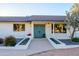 House exterior with teal front doors and landscaping at 6212 S 37Th St, Phoenix, AZ 85042