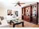 Living Room with sectional sofa, coffee table, and built-in shelving at 6212 S 37Th St, Phoenix, AZ 85042