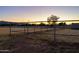 Metal fence around a large empty horse pasture at 6212 S 37Th St, Phoenix, AZ 85042