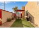 Small backyard with patio furniture and artificial turf at 625 N Hamilton St # 11, Chandler, AZ 85225