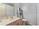 Clean bathroom with vanity, toilet, and shelving at 625 N Hamilton St # 11, Chandler, AZ 85225