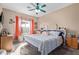 Spacious bedroom with king-size bed and ceiling fan at 625 N Hamilton St # 11, Chandler, AZ 85225