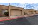 Row of tan stucco condos with attached garages at 625 N Hamilton St # 11, Chandler, AZ 85225