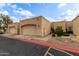 Tan stucco condo with a single-car garage and small front yard at 625 N Hamilton St # 11, Chandler, AZ 85225