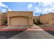 Tan stucco condo with a single-car garage and small front yard at 625 N Hamilton St # 11, Chandler, AZ 85225