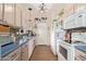 Well-equipped kitchen with white appliances and blue countertops at 625 N Hamilton St # 11, Chandler, AZ 85225