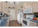 Bright kitchen, white appliances, blue countertops, and wood cabinets at 625 N Hamilton St # 11, Chandler, AZ 85225