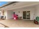 Covered patio with table, chairs and playhouse at 6252 E Billings St, Mesa, AZ 85205