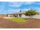 Artificial turf, patio, and a tree in the backyard at 6252 E Billings St, Mesa, AZ 85205