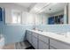 Bathroom with light blue tiled walls and vanity at 6252 E Billings St, Mesa, AZ 85205