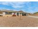 Ranch style home with carport, solar panels, and landscaped yard at 6252 E Billings St, Mesa, AZ 85205