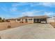 Ranch style home with carport, solar panels, and landscaped yard at 6252 E Billings St, Mesa, AZ 85205