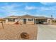 Ranch style home with carport, solar panels, and landscaped yard at 6252 E Billings St, Mesa, AZ 85205