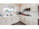 White kitchen cabinets, built in microwave and oven at 6252 E Billings St, Mesa, AZ 85205