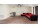 Living room with sectional sofa, built in shelving and ceiling fan at 6252 E Billings St, Mesa, AZ 85205