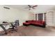 Living room with sectional sofa, built in shelving and ceiling fan at 6252 E Billings St, Mesa, AZ 85205