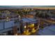 Twilight aerial view of a neighborhood featuring contemporary homes and lush landscaping at 6301 N 12Th St # 8, Phoenix, AZ 85014