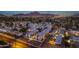 Aerial view of the community showcasing modern homes, lush green spaces, and a mountain backdrop at 6301 N 12Th St # 8, Phoenix, AZ 85014