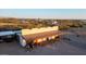 Rustic barn with covered patio and tractor at 6469 S Alameda Rd, Gold Canyon, AZ 85118