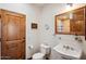 Clean bathroom with pedestal sink and tiled shower at 6469 S Alameda Rd, Gold Canyon, AZ 85118