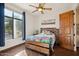 Charming bedroom with wood flooring and large windows at 6469 S Alameda Rd, Gold Canyon, AZ 85118