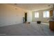 Large unfinished bedroom with ample natural light at 6469 S Alameda Rd, Gold Canyon, AZ 85118