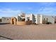 Spanish-style home with stucco exterior, arched entryway, and attached garage at 6469 S Alameda Rd, Gold Canyon, AZ 85118