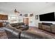 Spacious game room, featuring a large TV and wooden cabinetry at 6469 S Alameda Rd, Gold Canyon, AZ 85118