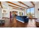 Open living room with wood beams and terracotta tile floors at 6469 S Alameda Rd, Gold Canyon, AZ 85118