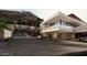 Modern home's driveway with water feature and luxury car at 7236 N 40Th St # 8, Paradise Valley, AZ 85253