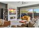 Comfortable living room featuring a fireplace and built-in shelving at 7363 E Casitas Del Rio Dr, Scottsdale, AZ 85255