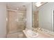 Bathroom with beige tile, shower/tub combo, and vanity at 7740 E Gainey Ranch Rd # 13, Scottsdale, AZ 85258