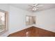 Bright bedroom with hardwood floors and window shutters at 7740 E Gainey Ranch Rd # 13, Scottsdale, AZ 85258