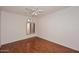 Bedroom with hardwood floors and window shutters at 7740 E Gainey Ranch Rd # 13, Scottsdale, AZ 85258