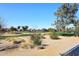 Scenic view of a lush green golf course with residential homes in the background at 7740 E Gainey Ranch Rd # 13, Scottsdale, AZ 85258