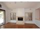 Living room with hardwood floors and a fireplace at 7740 E Gainey Ranch Rd # 13, Scottsdale, AZ 85258