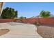 Backyard with concrete patio, rock features, and a pool at 8527 W Aster Dr, Peoria, AZ 85381